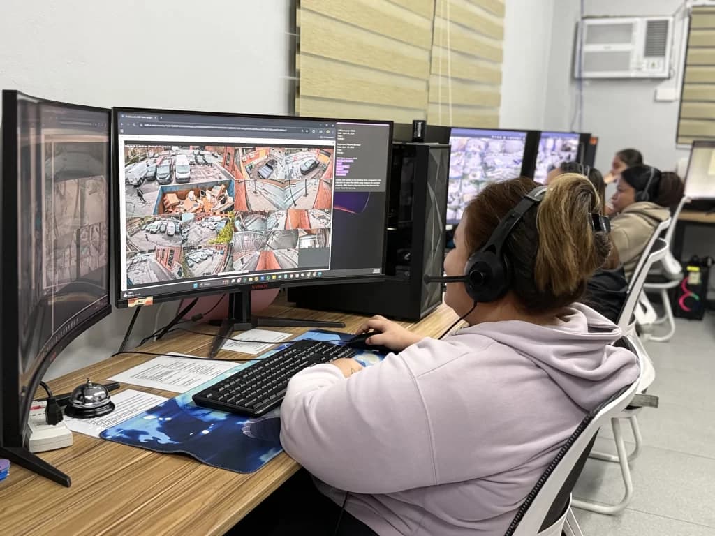 A SecureSight operator reviewing real-time multi-camera footage at a monitoring station
